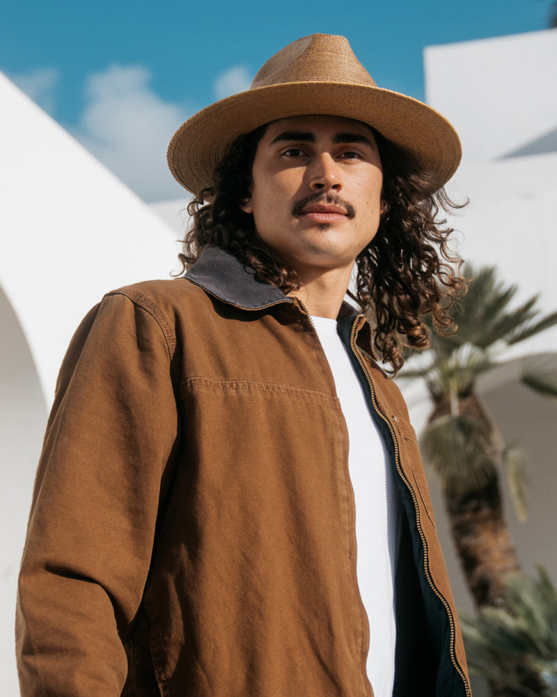 Hemlock male model wearing the Botero Straw Fedora in Saddle 