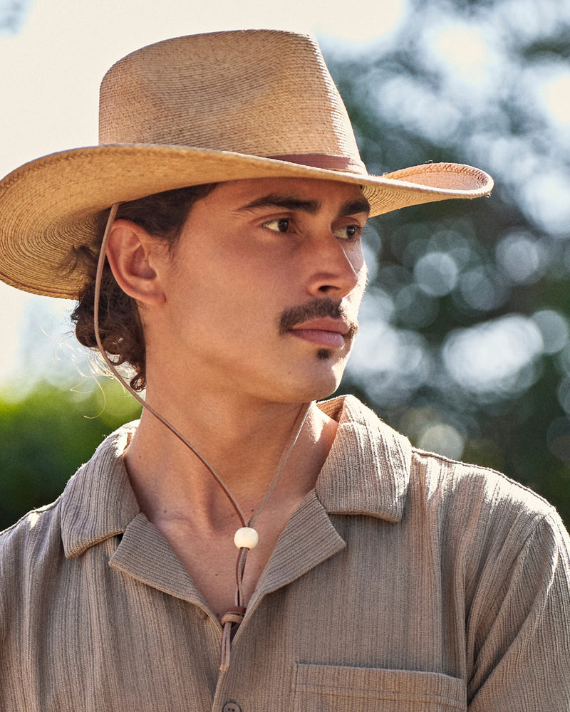 Hemlock male model wearing the Bruma Cowboy Fedora Straw Hat close up