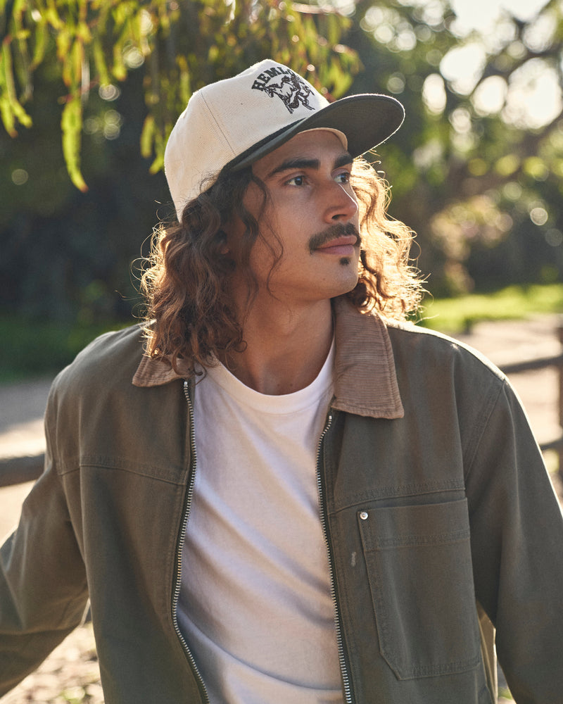 Hemlock male model wearing the Buckin Baseball Hat Green