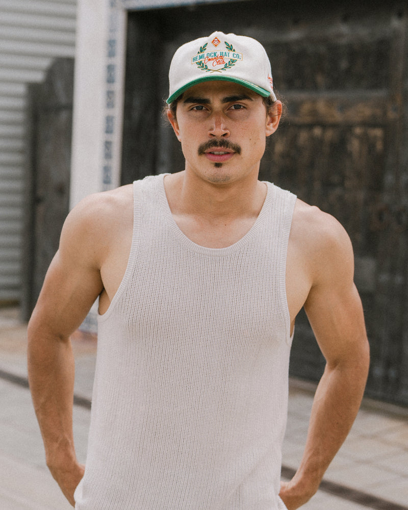 Hemlock male model wearing the Fairway baseball hat in emerald