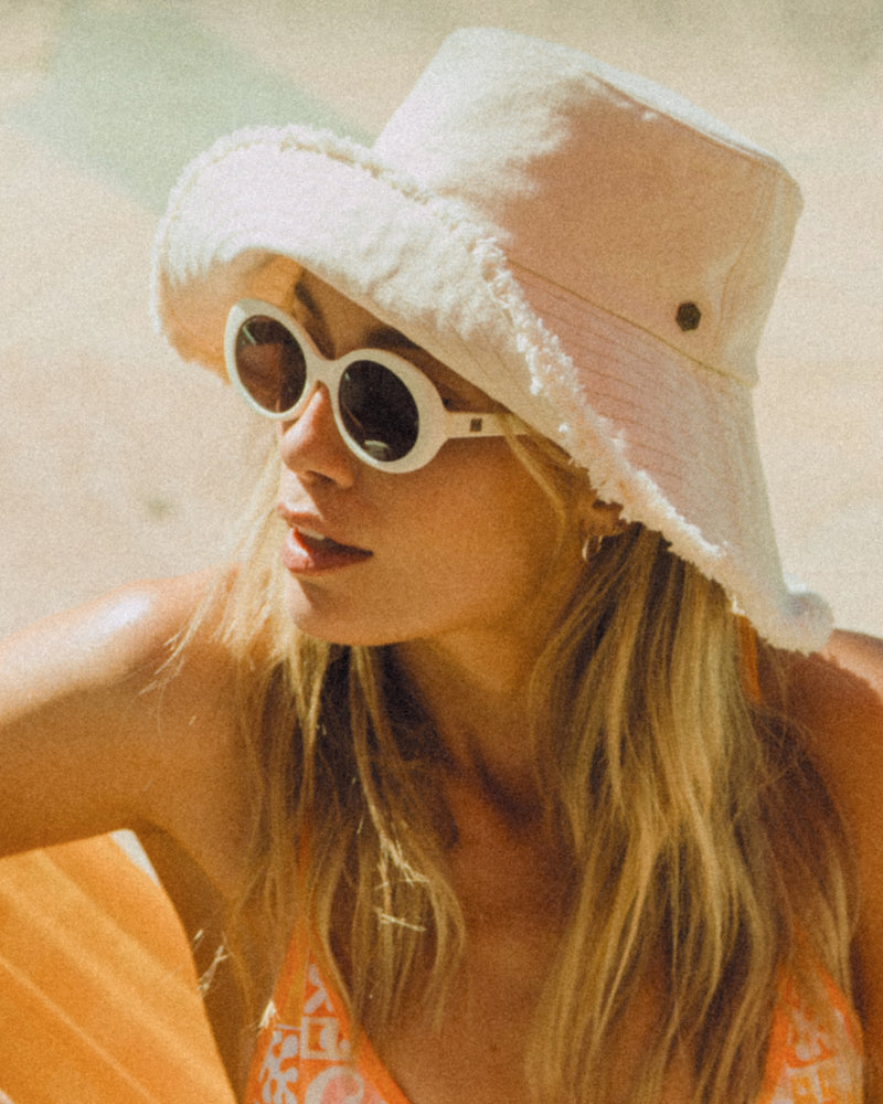 Hemlock female model wearing the Ibiza Wide Brim Bucket closeup side view