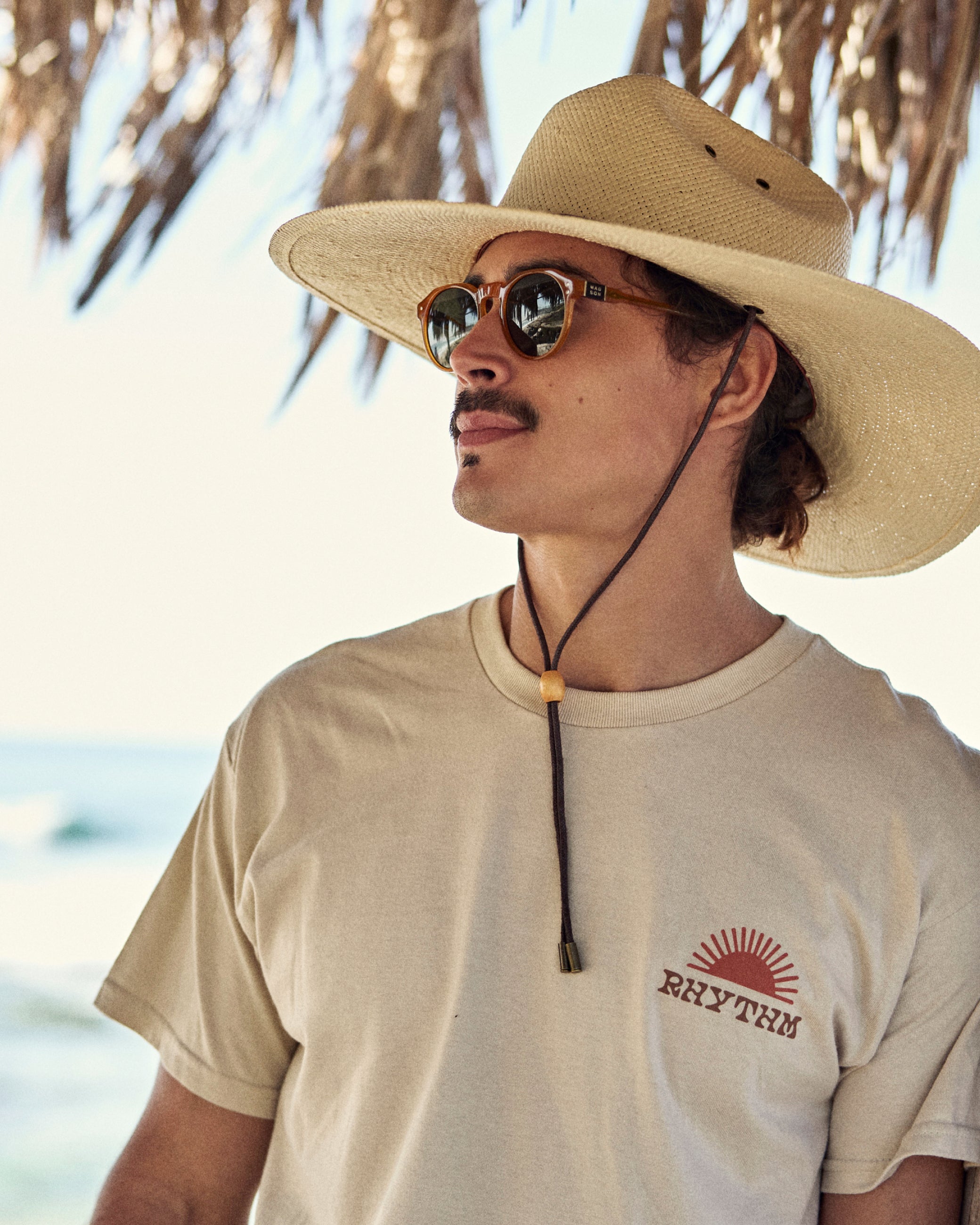 Hemlock male model wearing the Las Olas packable lifeguard in white sand