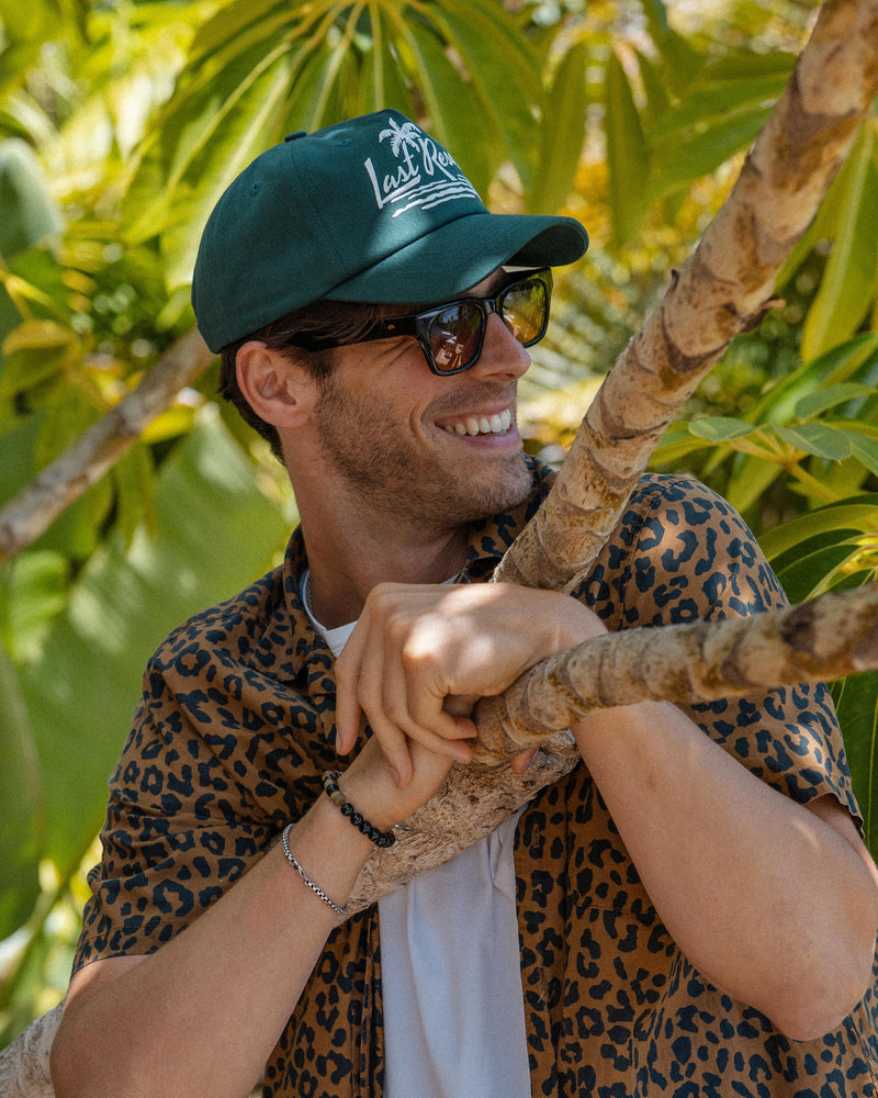 Hemlock male model wearing the Last Resort Baseball Hat in Green
