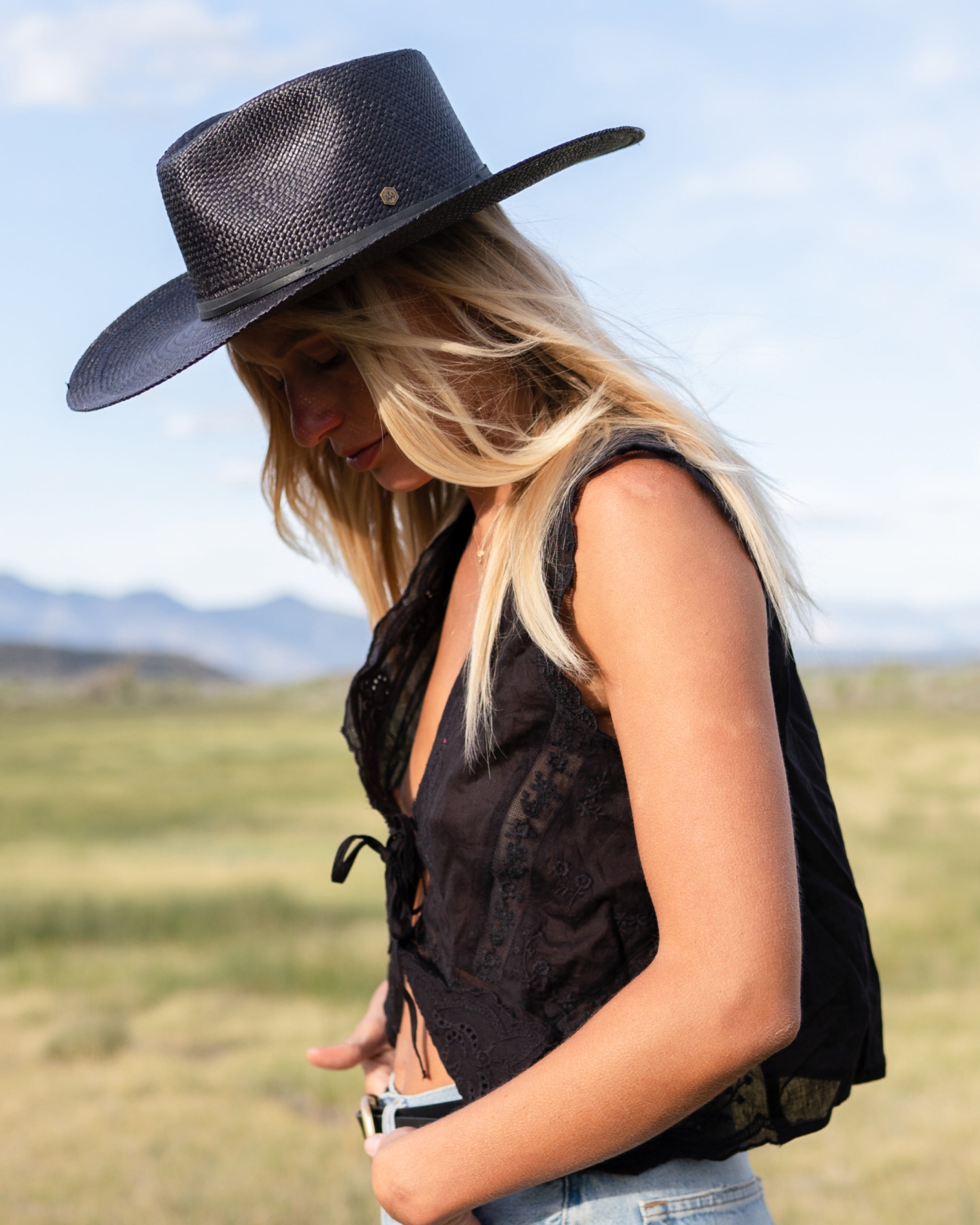 Hemlock female model wearing the Lazo Cowboy Panama Straw Hat in Black