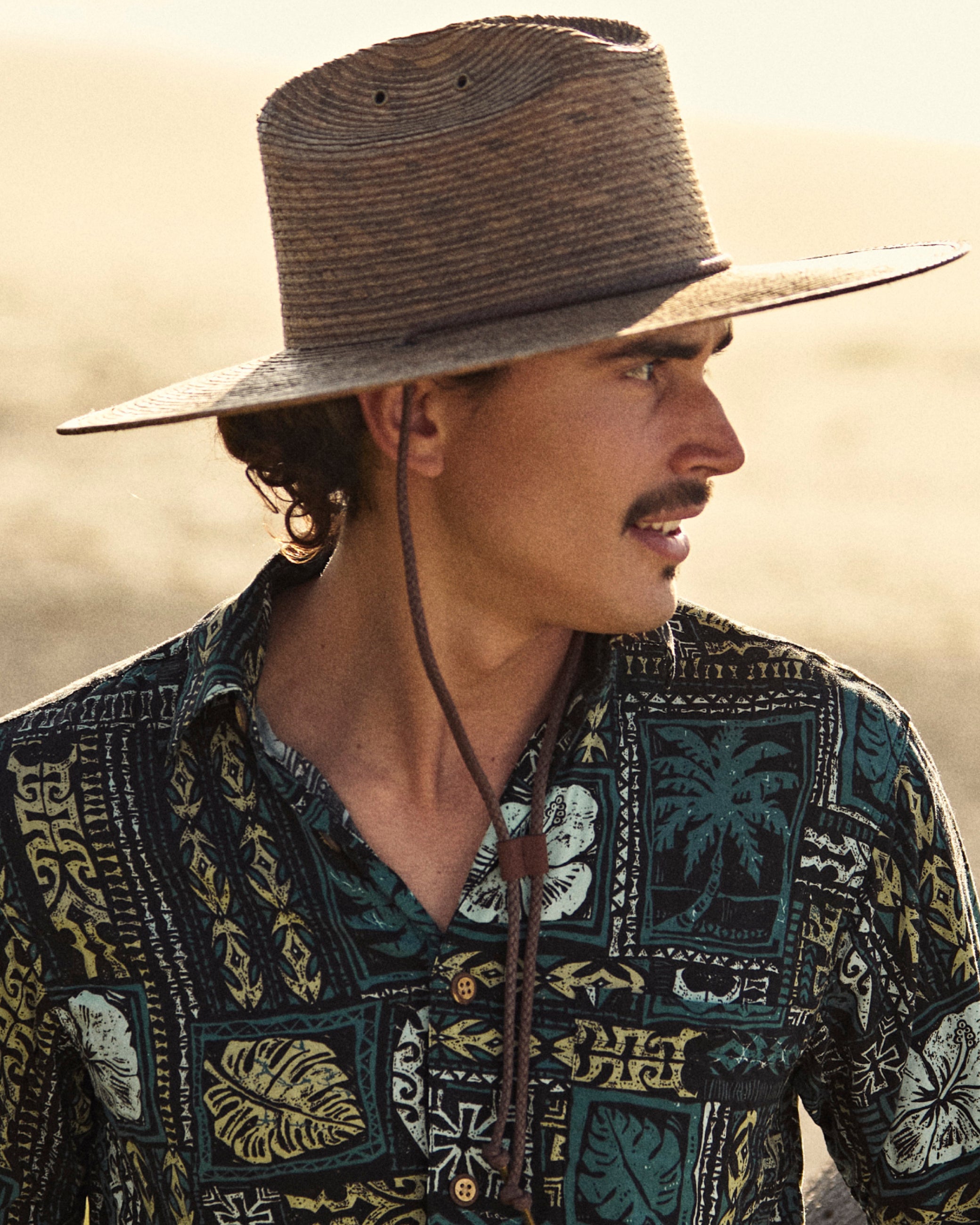 Hemlock male model wearing the Monterrey Rancher Straw Hat in Toast side profile