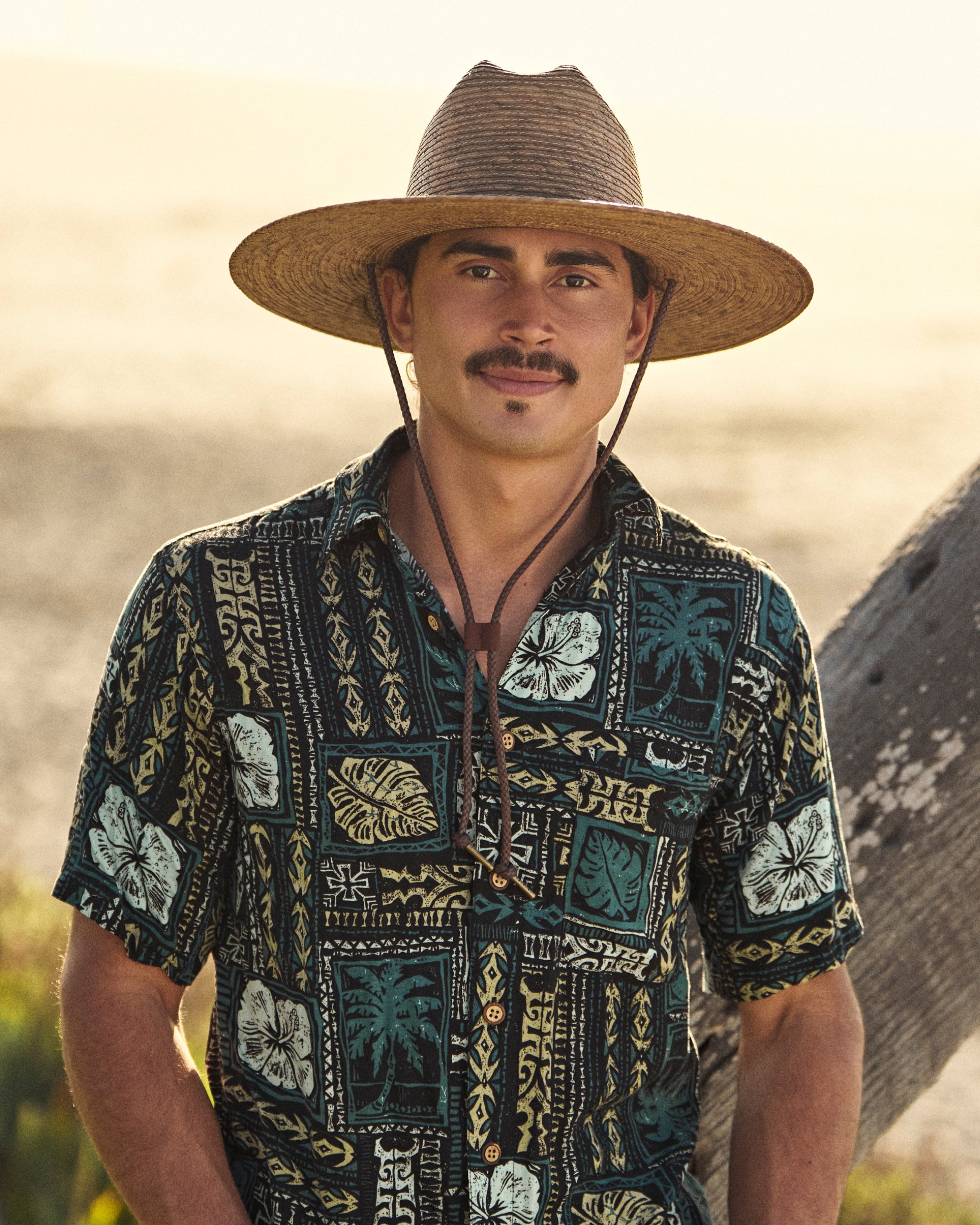 Hemlock male model wearing the Monterrey Rancher Straw Hat in Toast by the beach