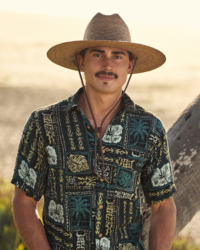 Hemlock male model wearing the Monterrey Rancher Straw Hat in Toast by the beach