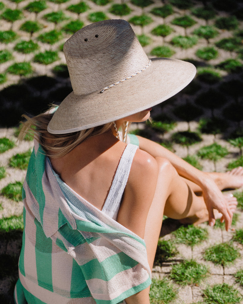 Hemlock female model wearing the Santos  Lifeguard Straw Hat side view