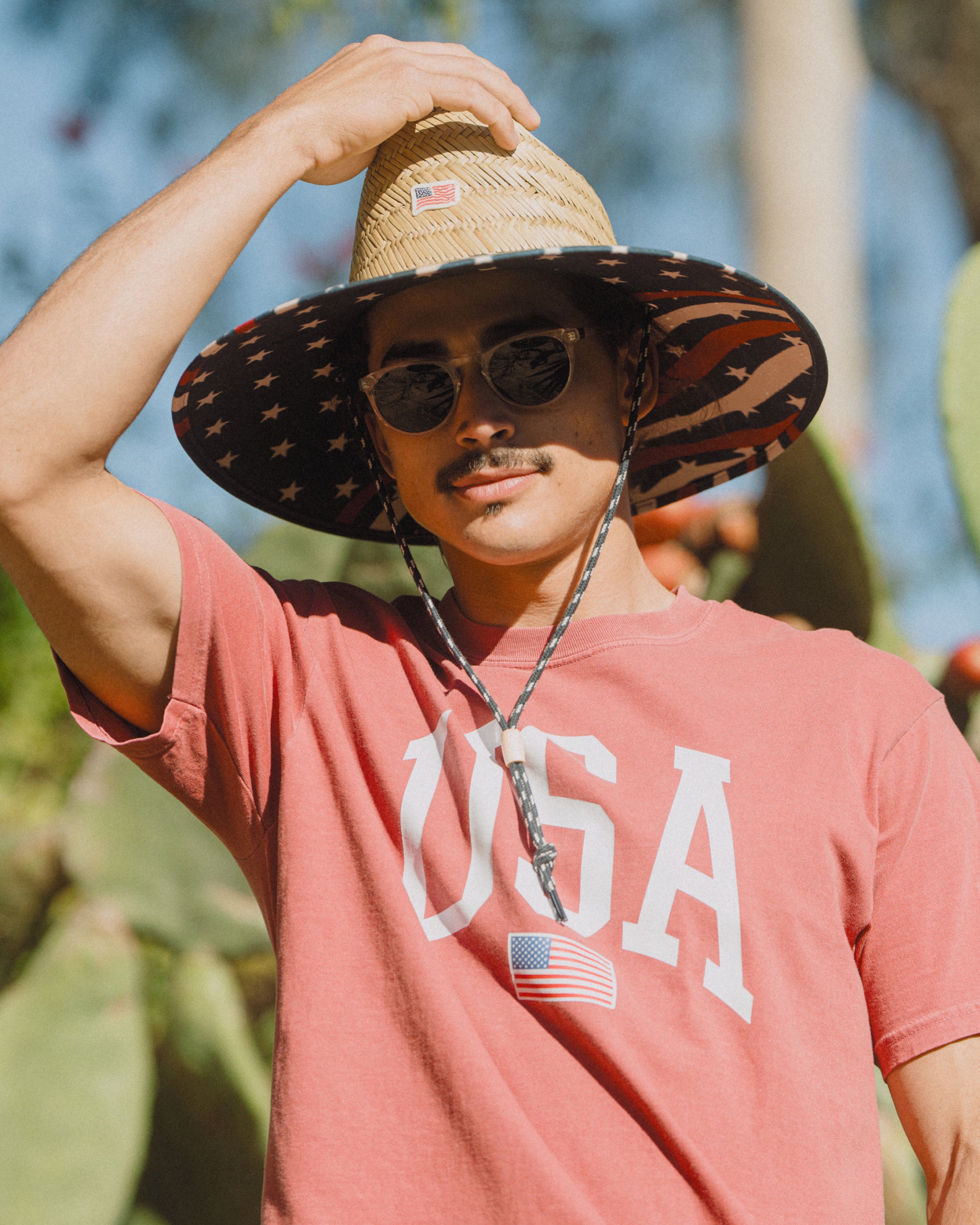Hemlock male model wearing the UPF50+ Lifeguard Straw Hat Stars & Stripes print