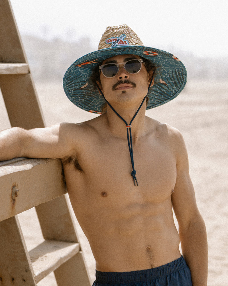 Hemlock male model wearing the UPF 50+ Lifeguard in Dive Inn at the beach