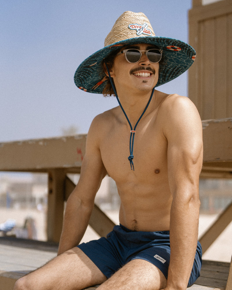 Hemlock male model wearing the UPF 50+ Lifeguard in Dive Inn at a sunny beach